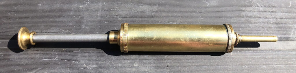 Vintage brass grease gun